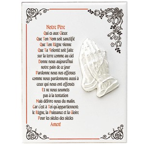 Céramique avec des mains en prière en relief